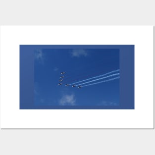 Squadron of seven aircraft against blue sky Posters and Art